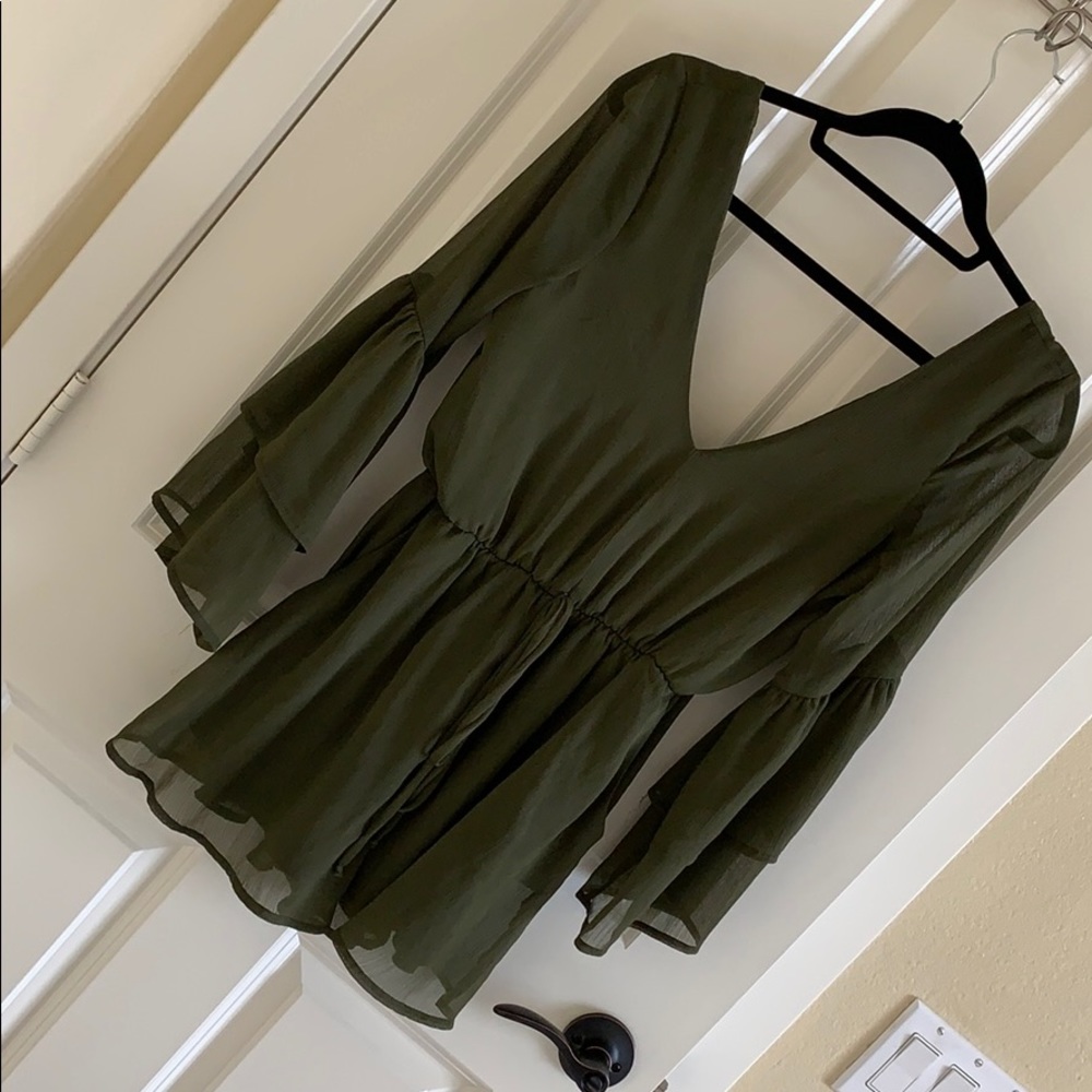 Cute army green romper! Open back and low v